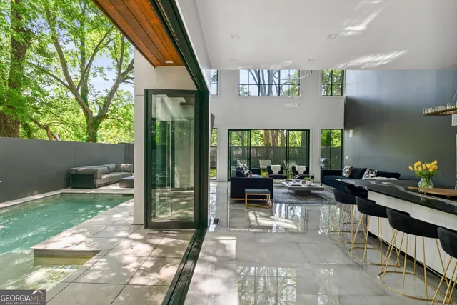 a lobby with furniture and floor to ceiling window