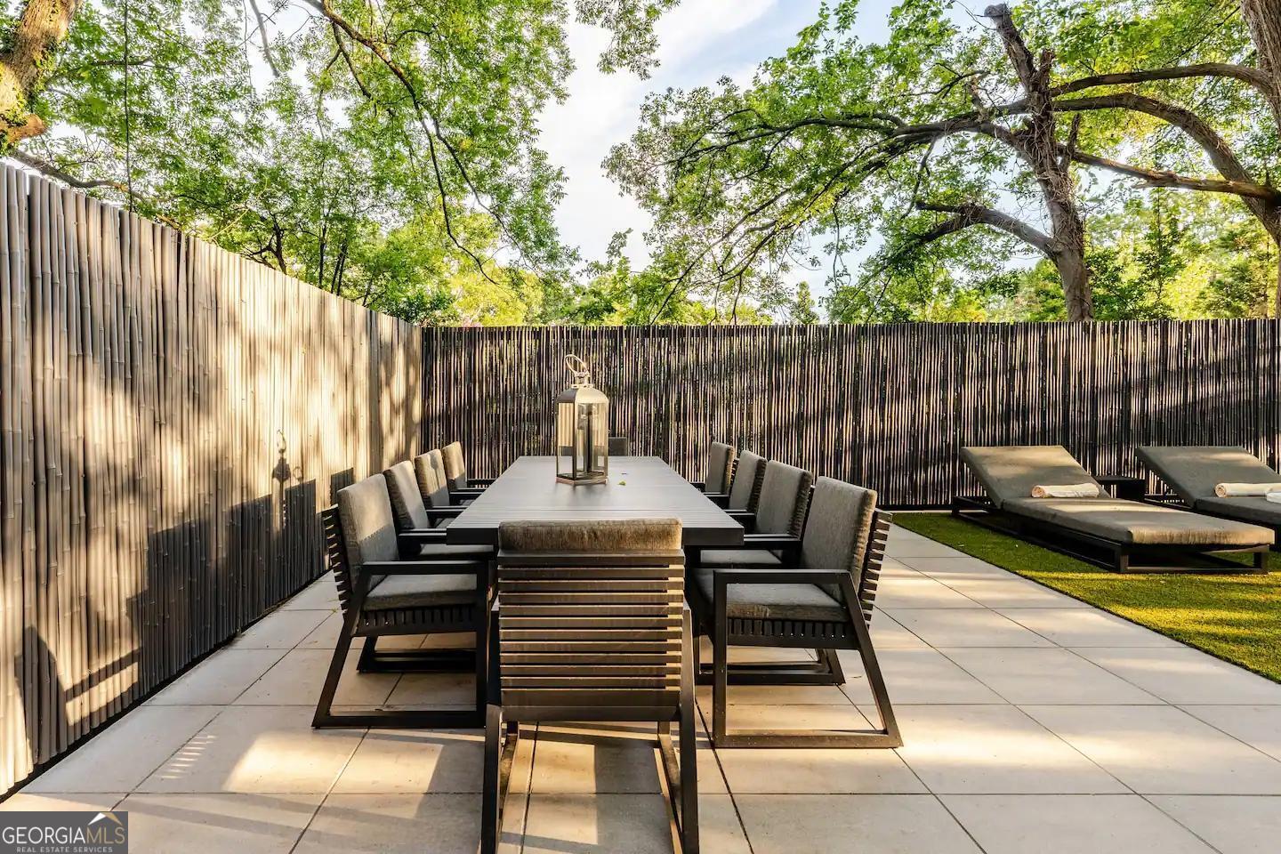 818 Verner Street Northwest Atlanta, GA 30318 - Photo 29 of 47 a view of a chairs and tables in the back yard of a house