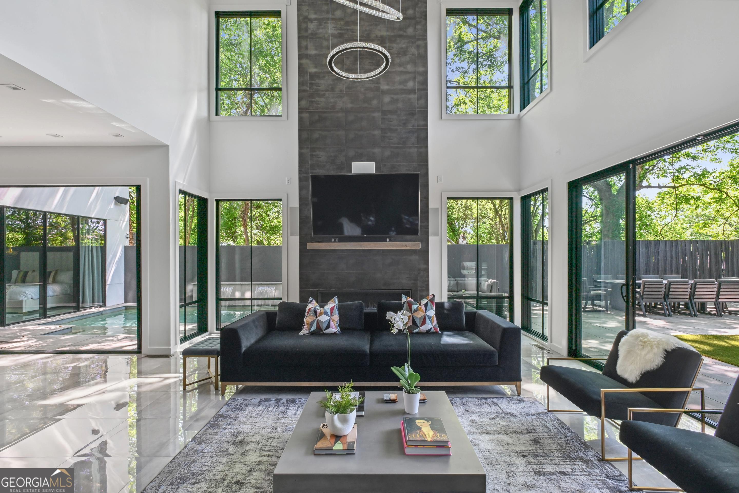 818 Verner Street Northwest Atlanta, GA 30318 - Photo 3 of 47 a living room with furniture and a floor to ceiling window