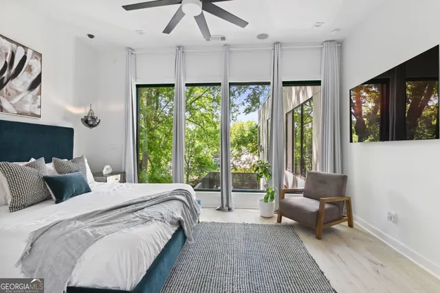 a bedroom with a bed and a couch