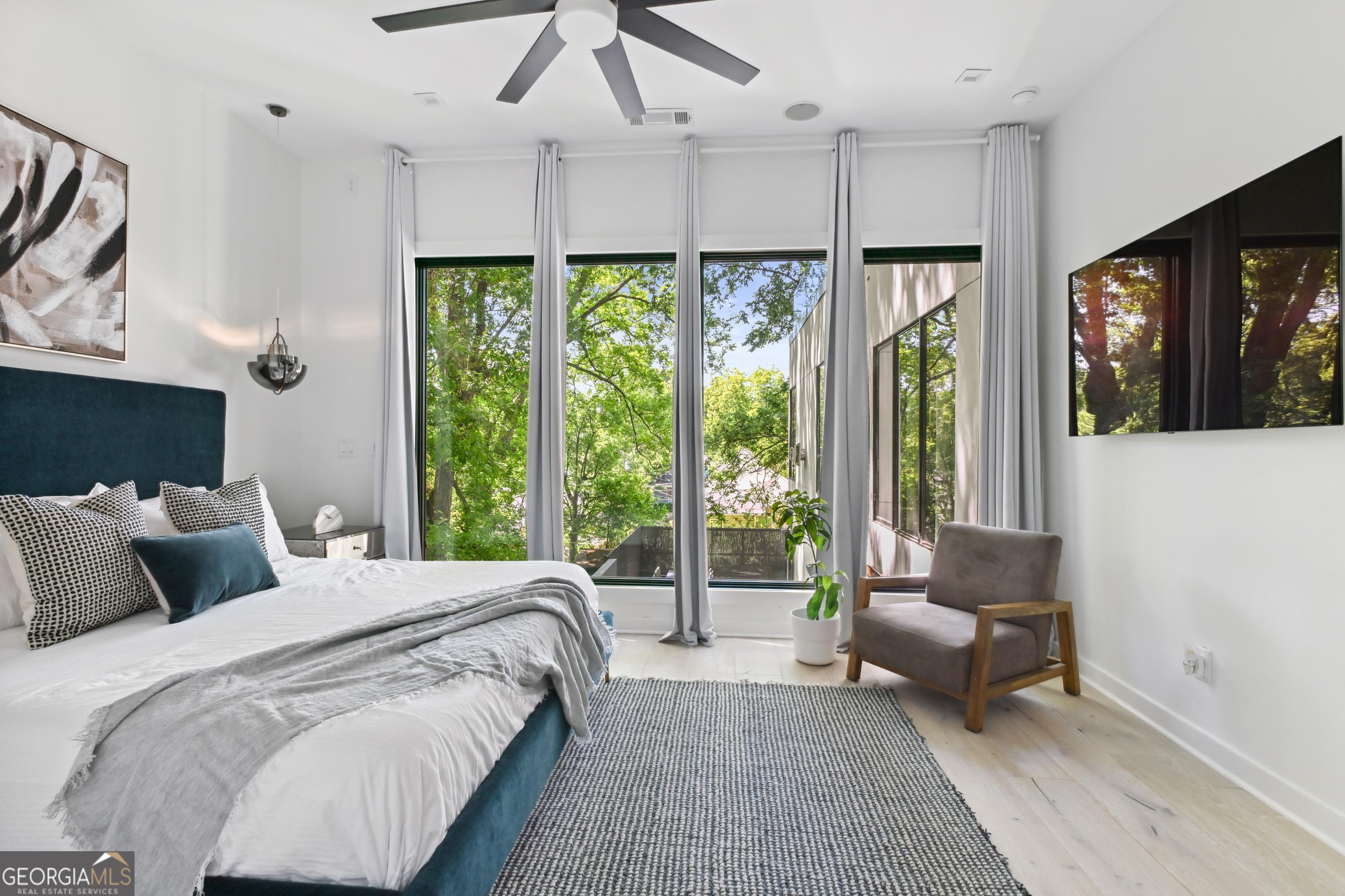 818 Verner Street Northwest Atlanta, GA 30318 - Photo 33 of 47 a bedroom with a bed and a couch