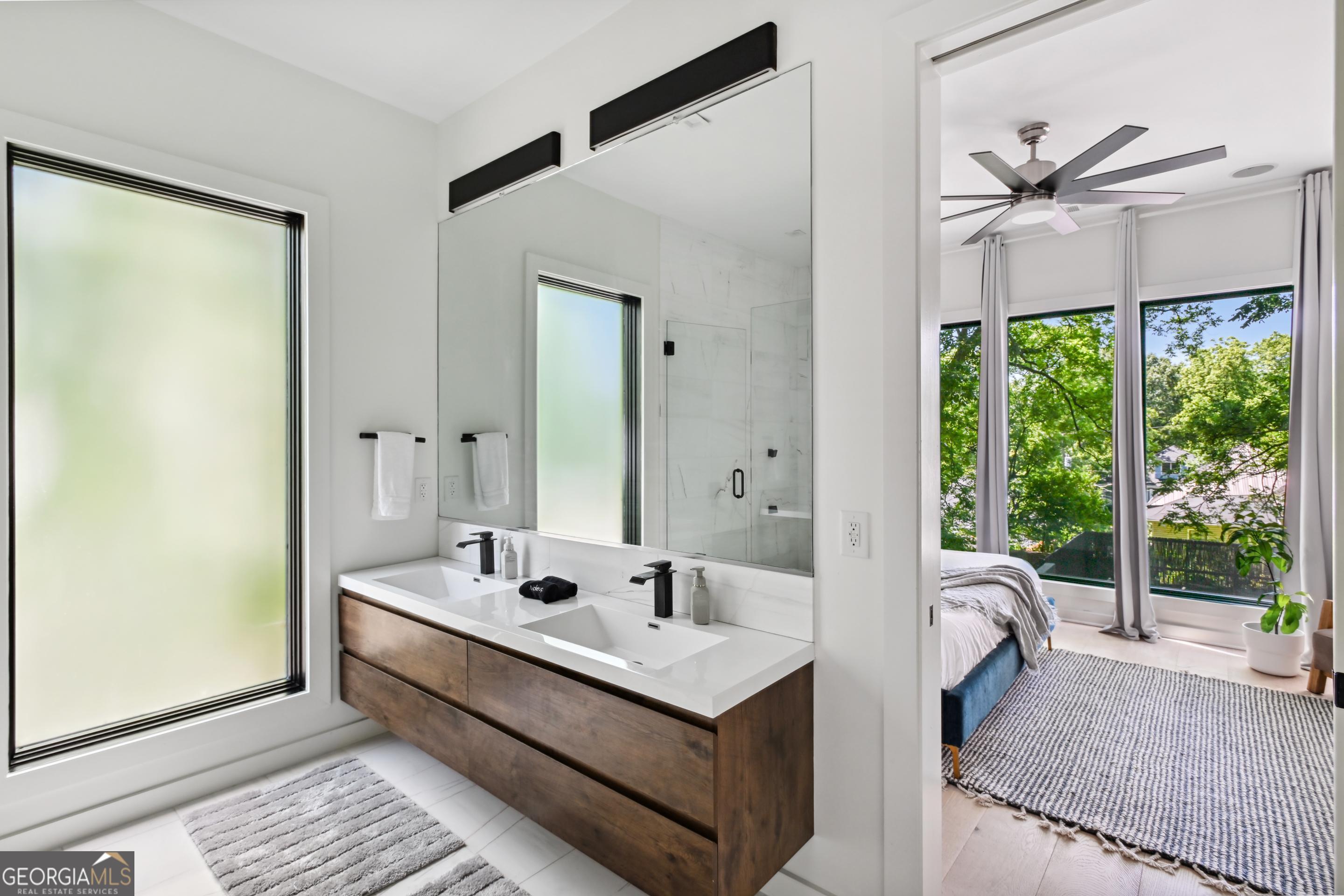 818 Verner Street Northwest Atlanta, GA 30318 - Photo 36 of 47 a bathroom with a sink and a mirror