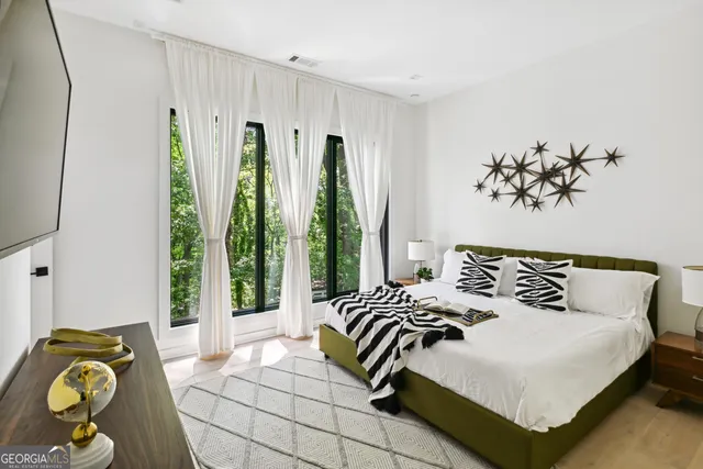 a bedroom with a bed and a couch