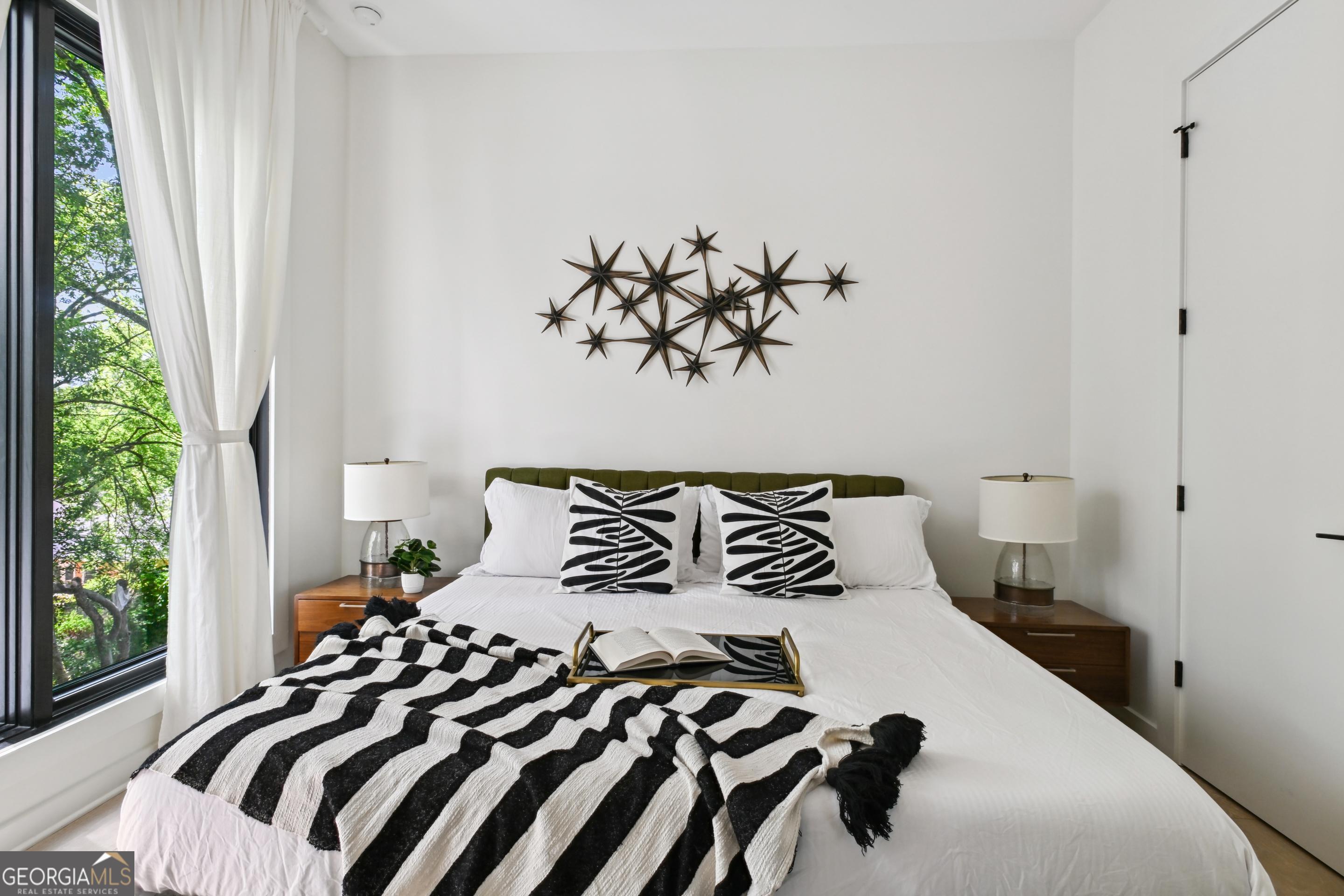 818 Verner Street Northwest Atlanta, GA 30318 - Photo 39 of 47 a bedroom with a bed and a window