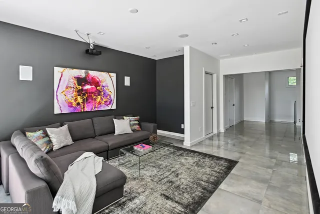 a living room with furniture and a rug