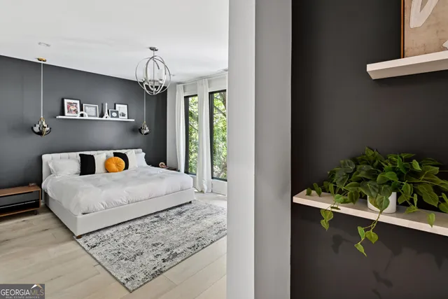 a bedroom with bed and window