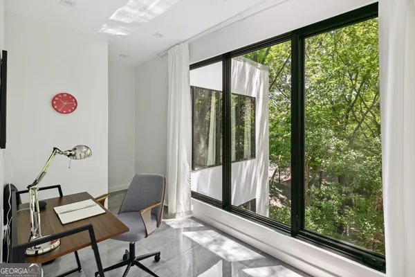 a view of a room with a floor to ceiling window