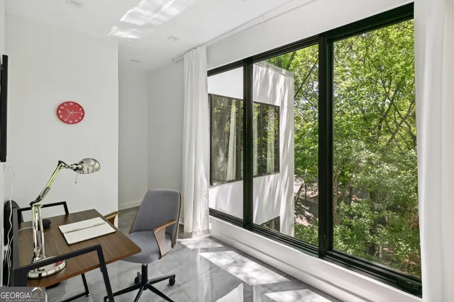 a view of a room with a floor to ceiling window