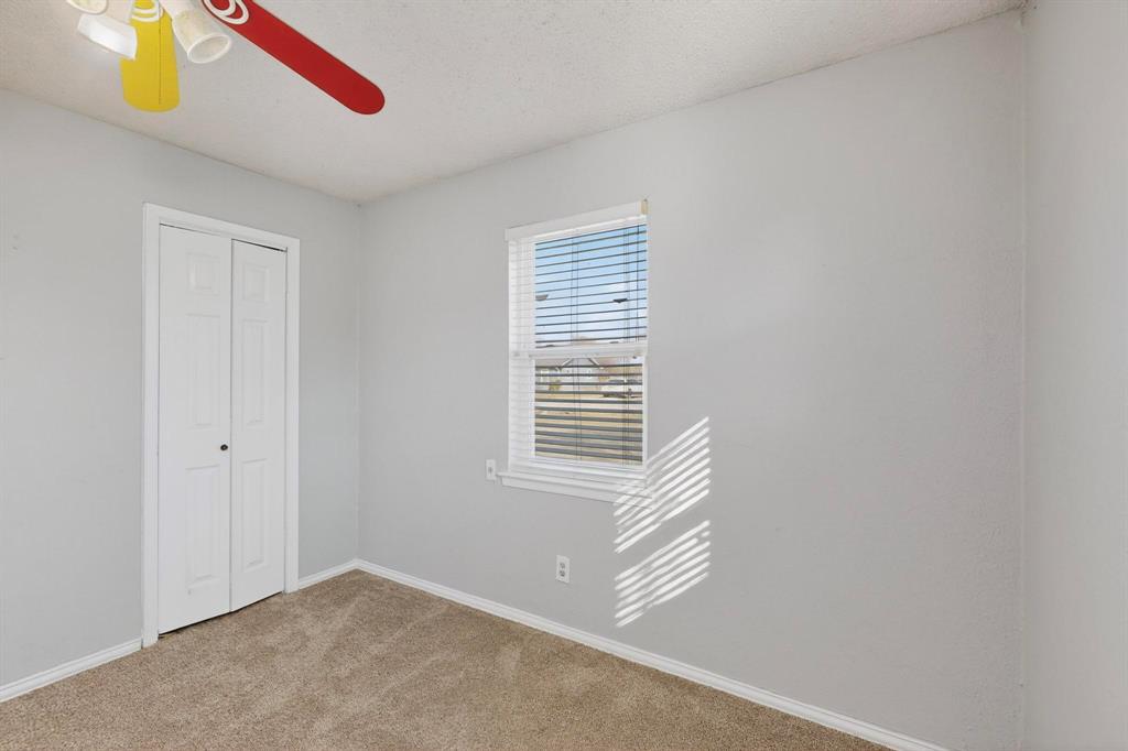104 Maxwell Road Hackberry, TX 75036 - Photo 14 of 32 a view of an empty room with a window