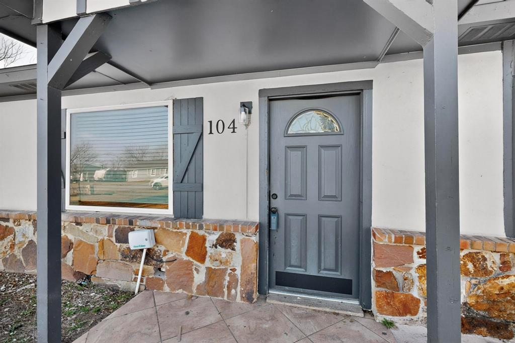 104 Maxwell Road Hackberry, TX 75036 - Photo 2 of 32 a front view of a house with a glass door