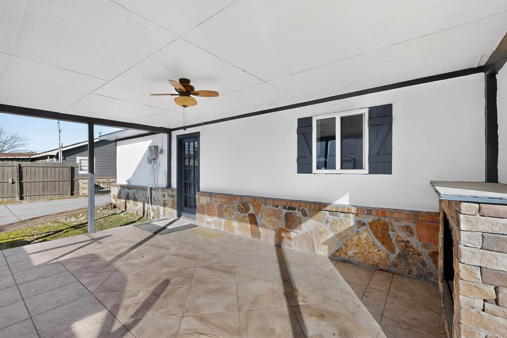 104 Maxwell Road Hackberry, TX 75036 - Photo 26 of 32 a very nice looking room with a large mirror and a ceiling fan