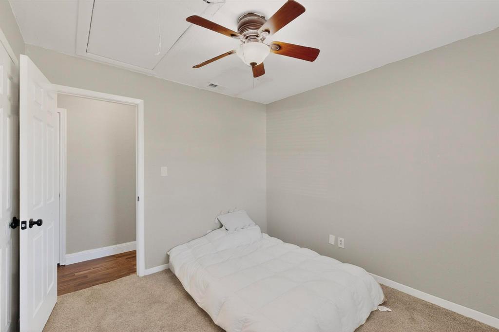104 Maxwell Road Hackberry, TX 75036 - Photo 29 of 32 an empty room with a ceiling fan and fan