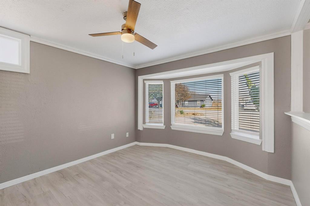104 Maxwell Road Hackberry, TX 75036 - Photo 10 of 32 a view of an empty room with a window