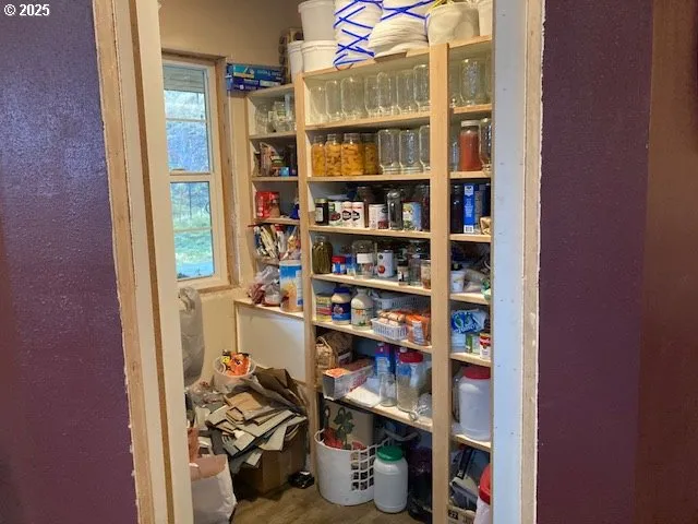 a room with water heater and wooden floor