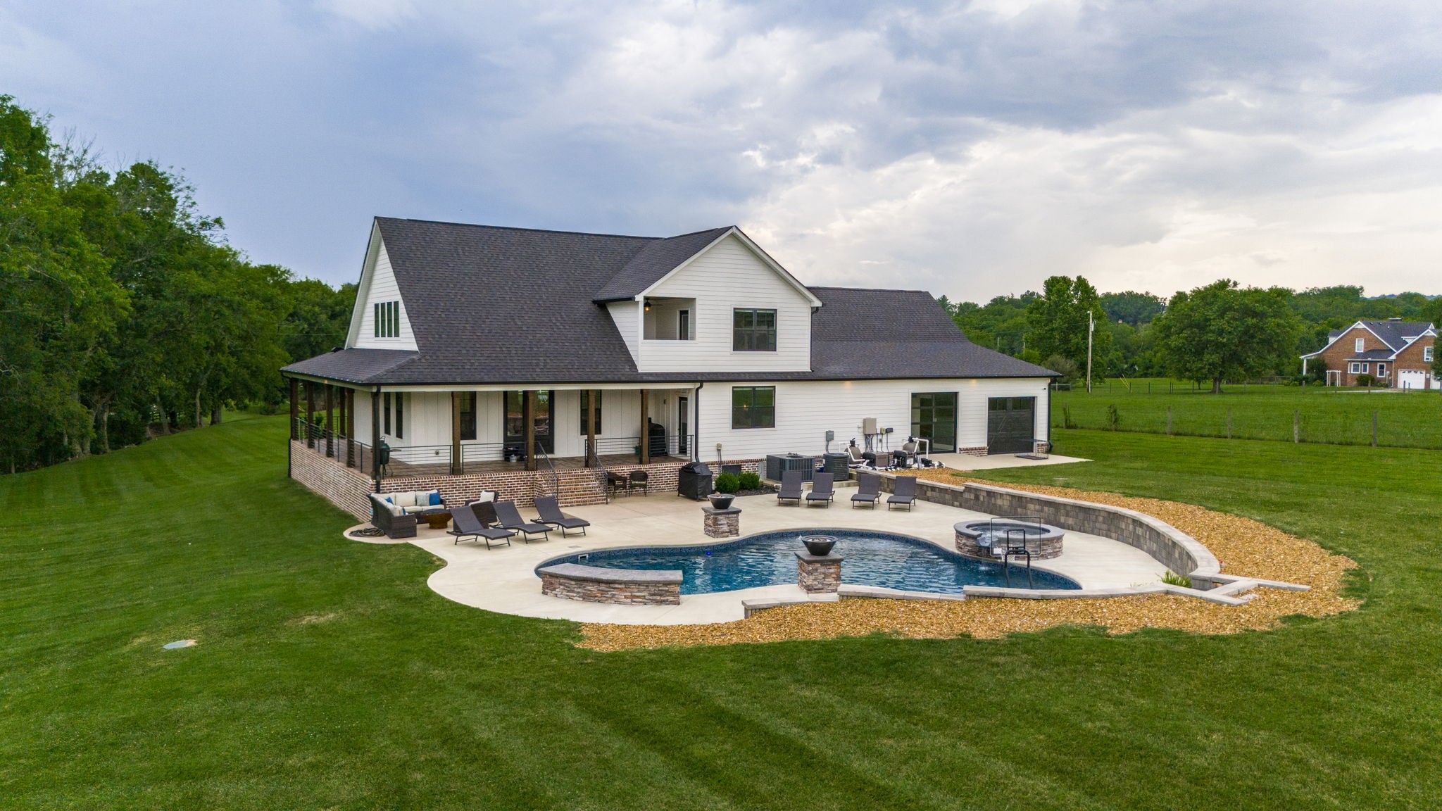968 Franklin Road Gallatin, TN 37066 - Photo 4 of 69 a front view of a house with swimming pool having outdoor seating