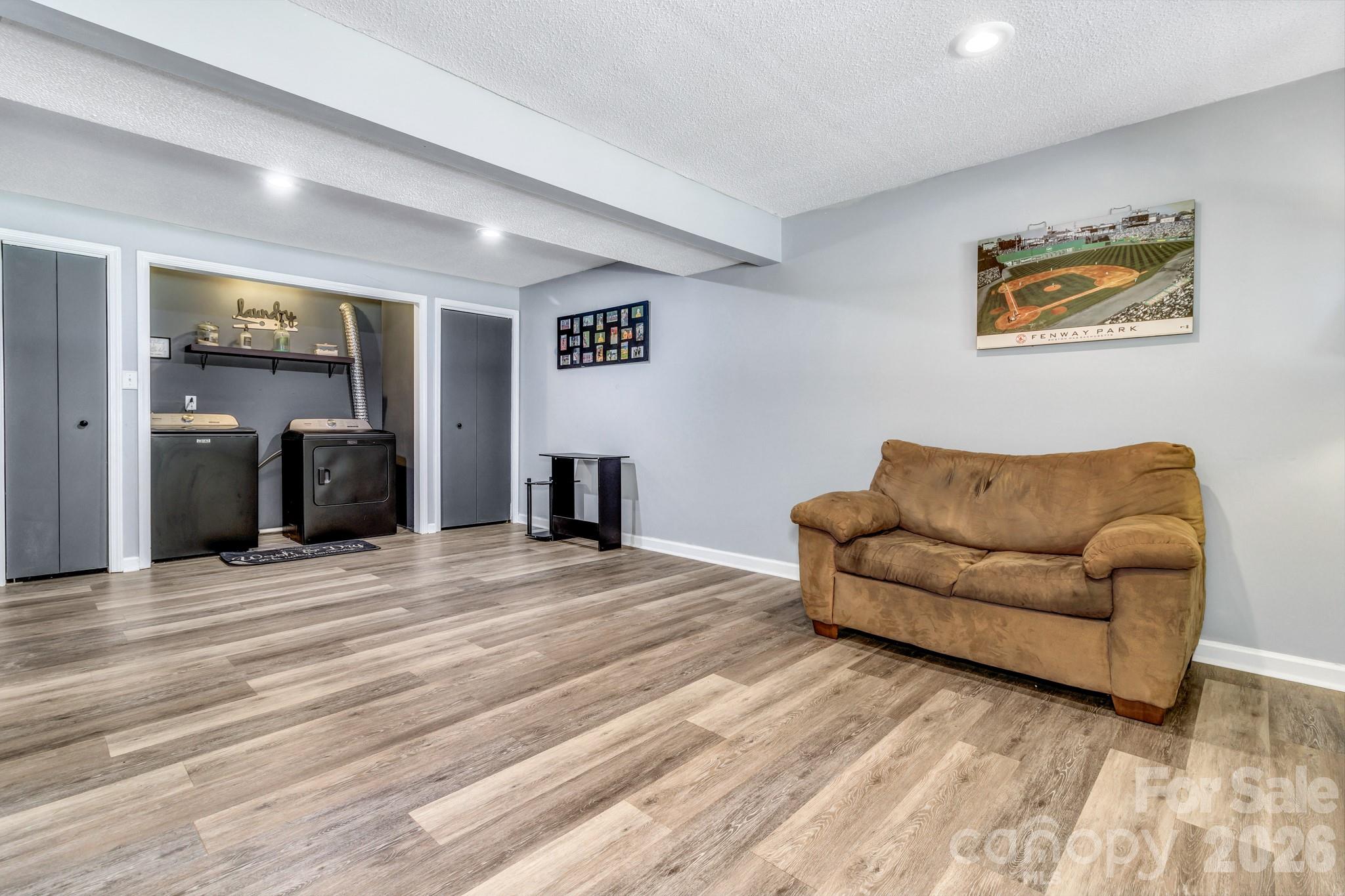 13 Spring Lake Drive Fletcher, NC 28732 - Photo 27 of 30 a living room with furniture and a wooden floor