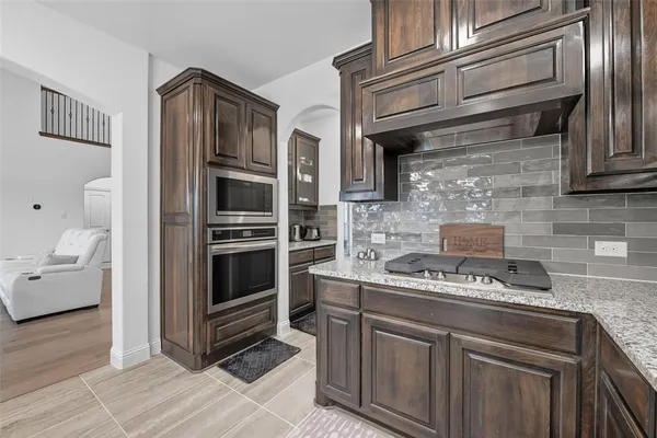 a kitchen with cabinets and appliances