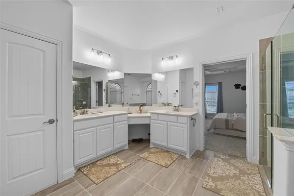 a room with a sink and a mirror