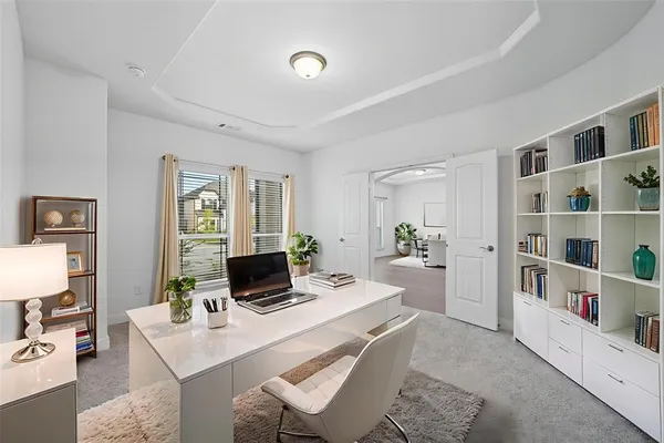 a living room with furniture and a table