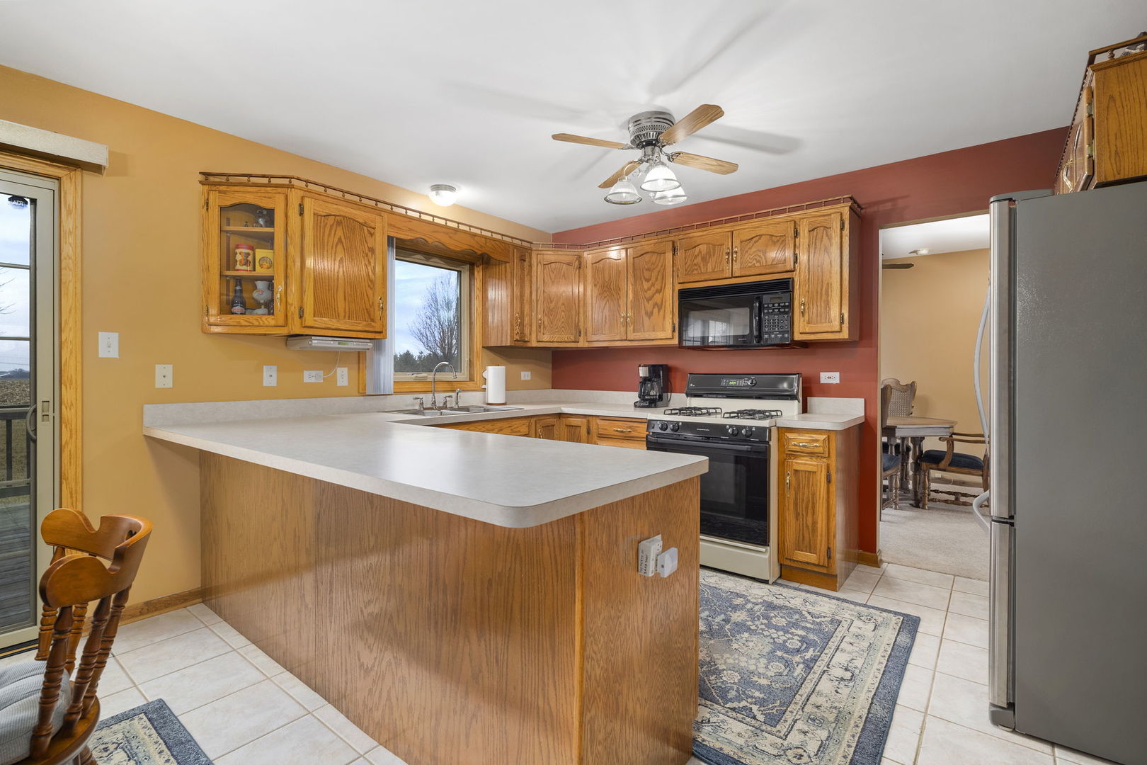 515 East Corning Road Beecher, IL 60401 - Photo 7 of 31 a kitchen with stainless steel appliances granite countertop a sink a stove and a refrigerator