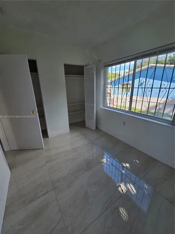 a view of livingroom and hardwood floor