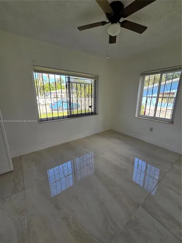 a view of an empty room and window