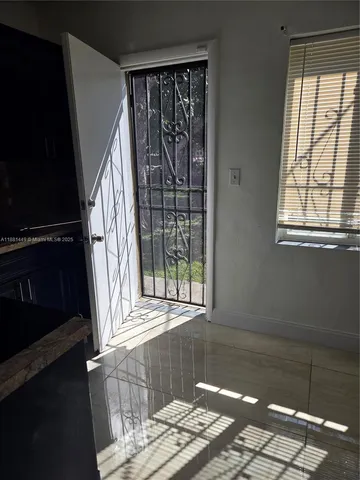 a view of wooden floor in an entryway