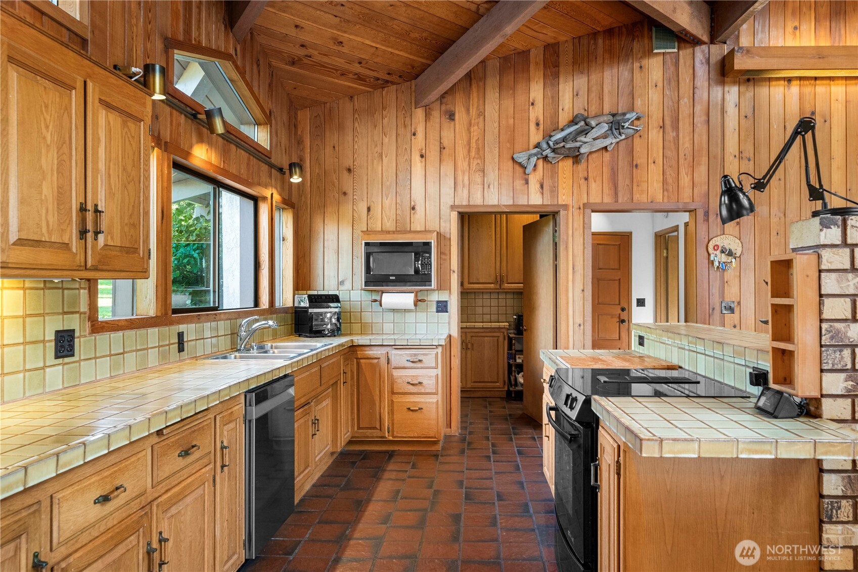 491 Bachelor Road Sequim, WA 98382 - Photo 10 of 39 a large kitchen with stainless steel appliances granite countertop a sink a stove and refrigerator