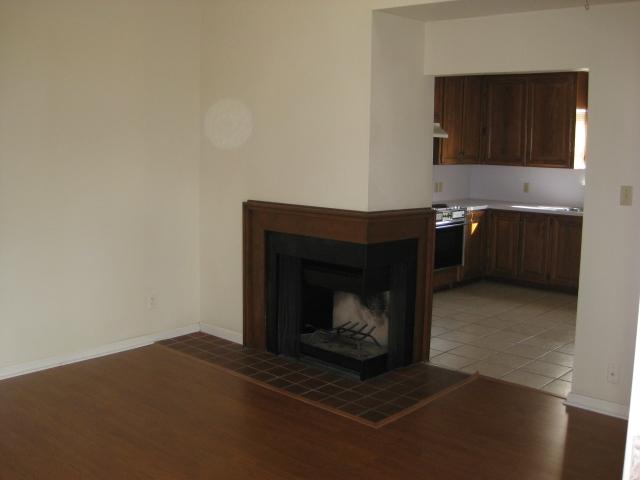 2529 Rio Grande Street, Unit 102 Austin, TX 78705 - Photo 2 of 7 a living room with a fireplace