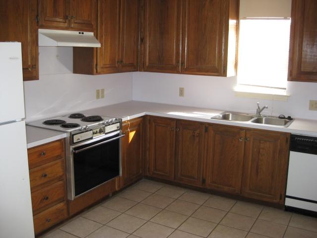 2529 Rio Grande Street, Unit 102 Austin, TX 78705 - Photo 5 of 7 a kitchen with stainless steel appliances a stove sink and cabinets