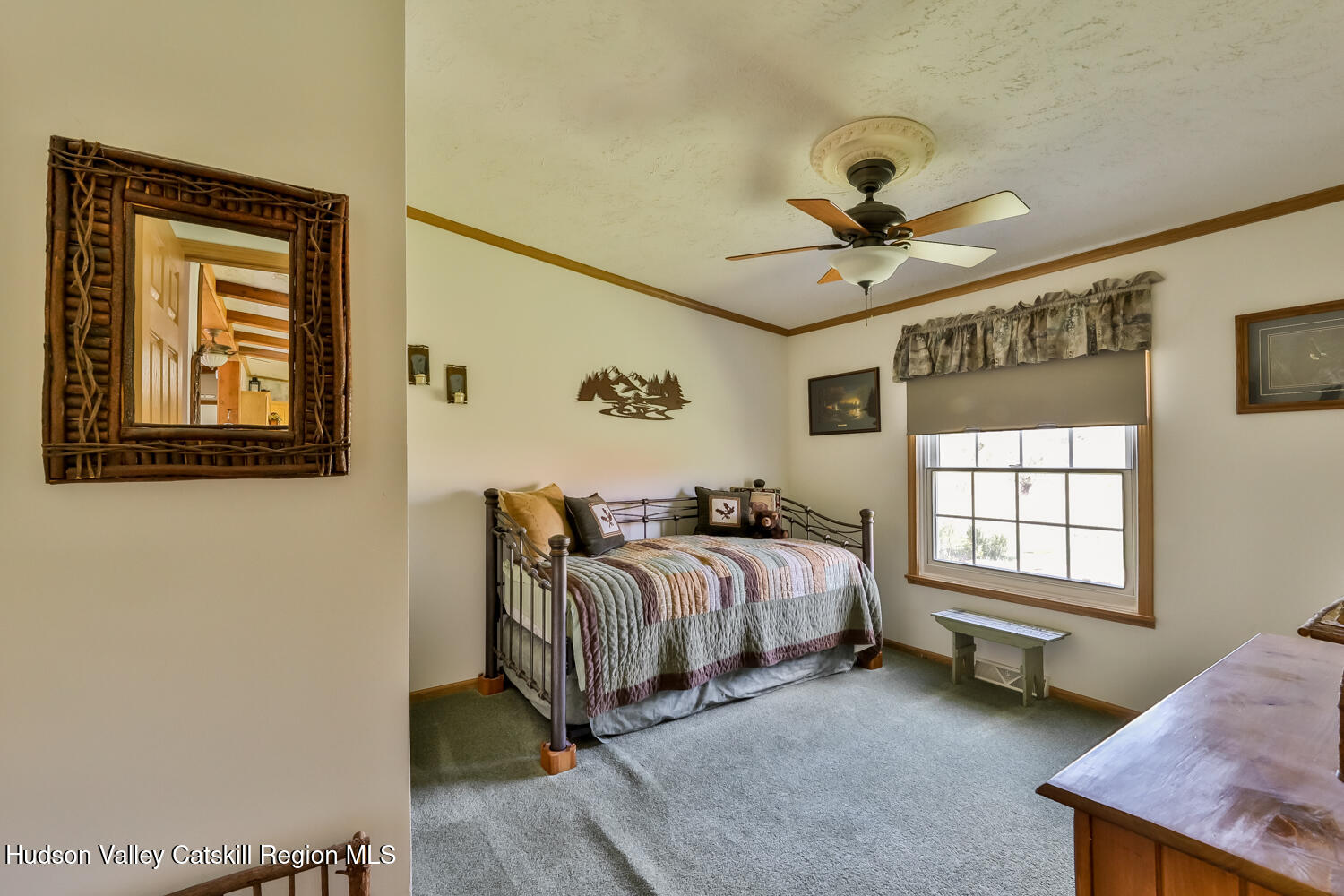 751 Mitchell Hollow Road Windham, NY 12496 - Photo 21 of 37 a spacious bedroom with a bed and a window