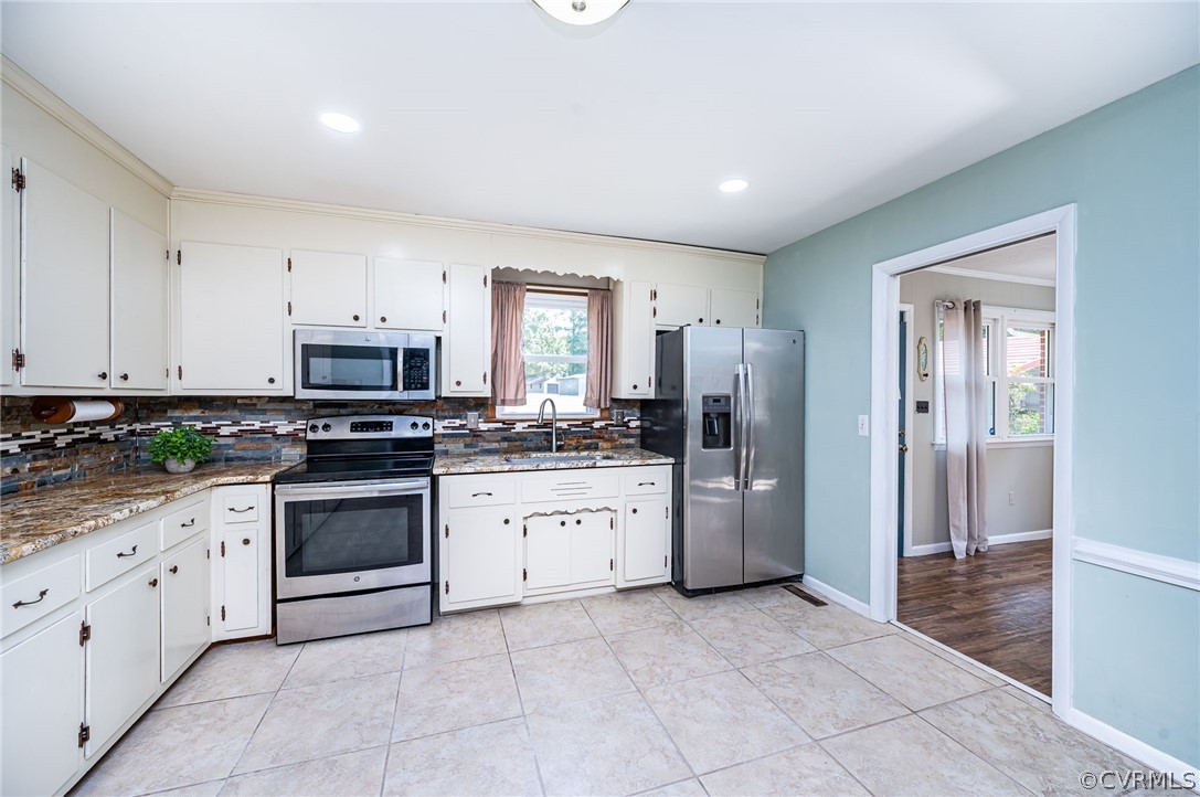 10901 Trents Bridge Road Chesterfield, VA 23838 - Photo 11 of 35 Kitchen with tile flooring, GRANITE counters, white cabinets & stainless appliances