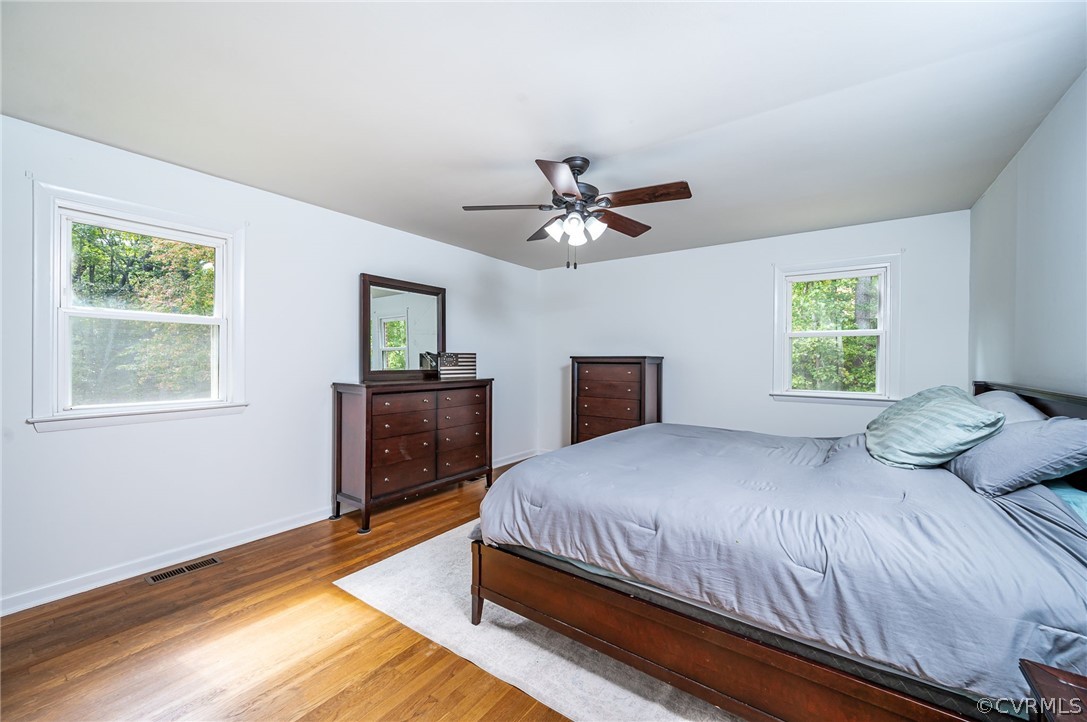 10901 Trents Bridge Road Chesterfield, VA 23838 - Photo 17 of 35 Primary Bedroom #1 with wood flooring, ceiling fan & attached bathroom