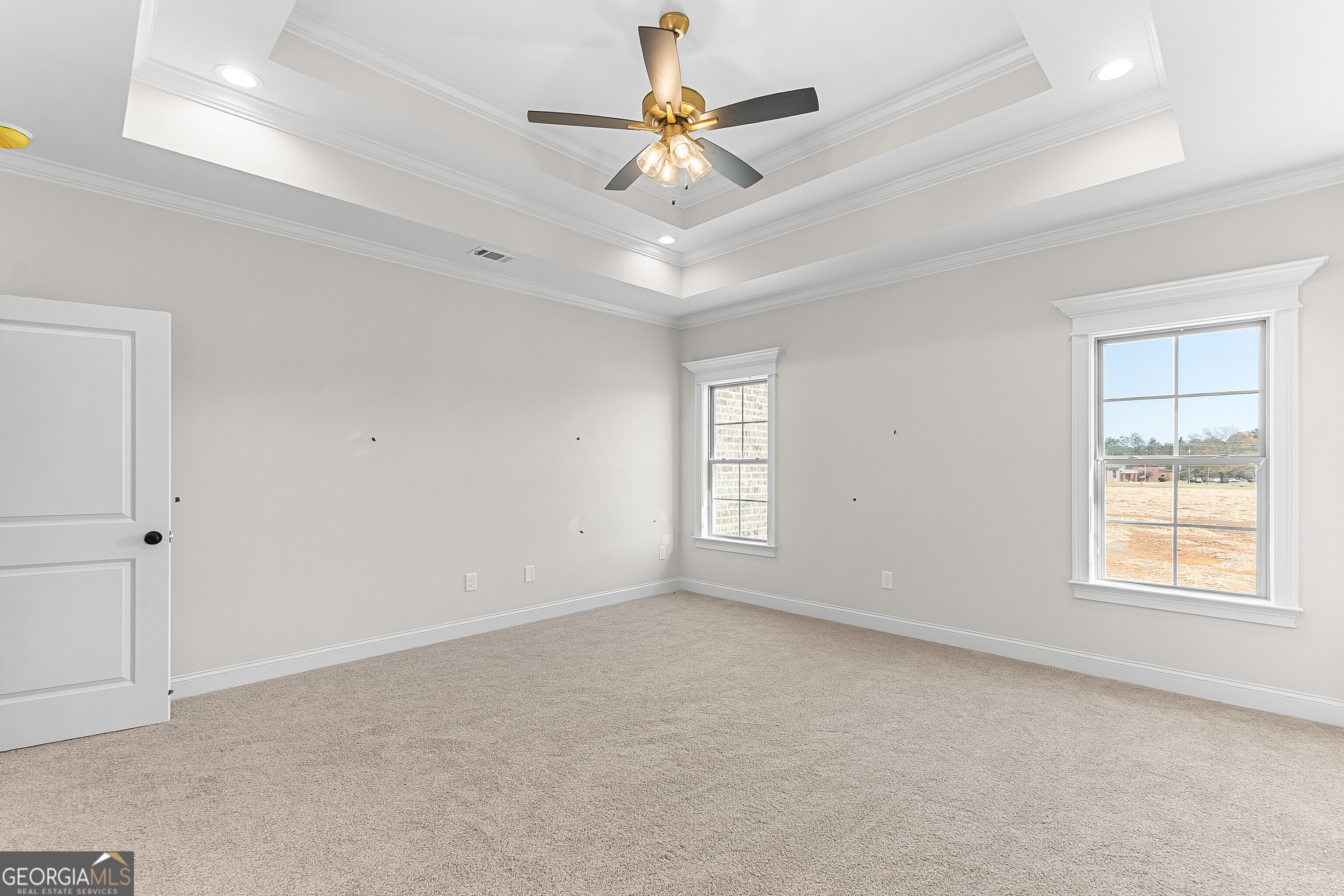 206 Farrell Way Perry, GA 31069 - Photo 13 of 15 a view of an empty room with window and chandelier fan