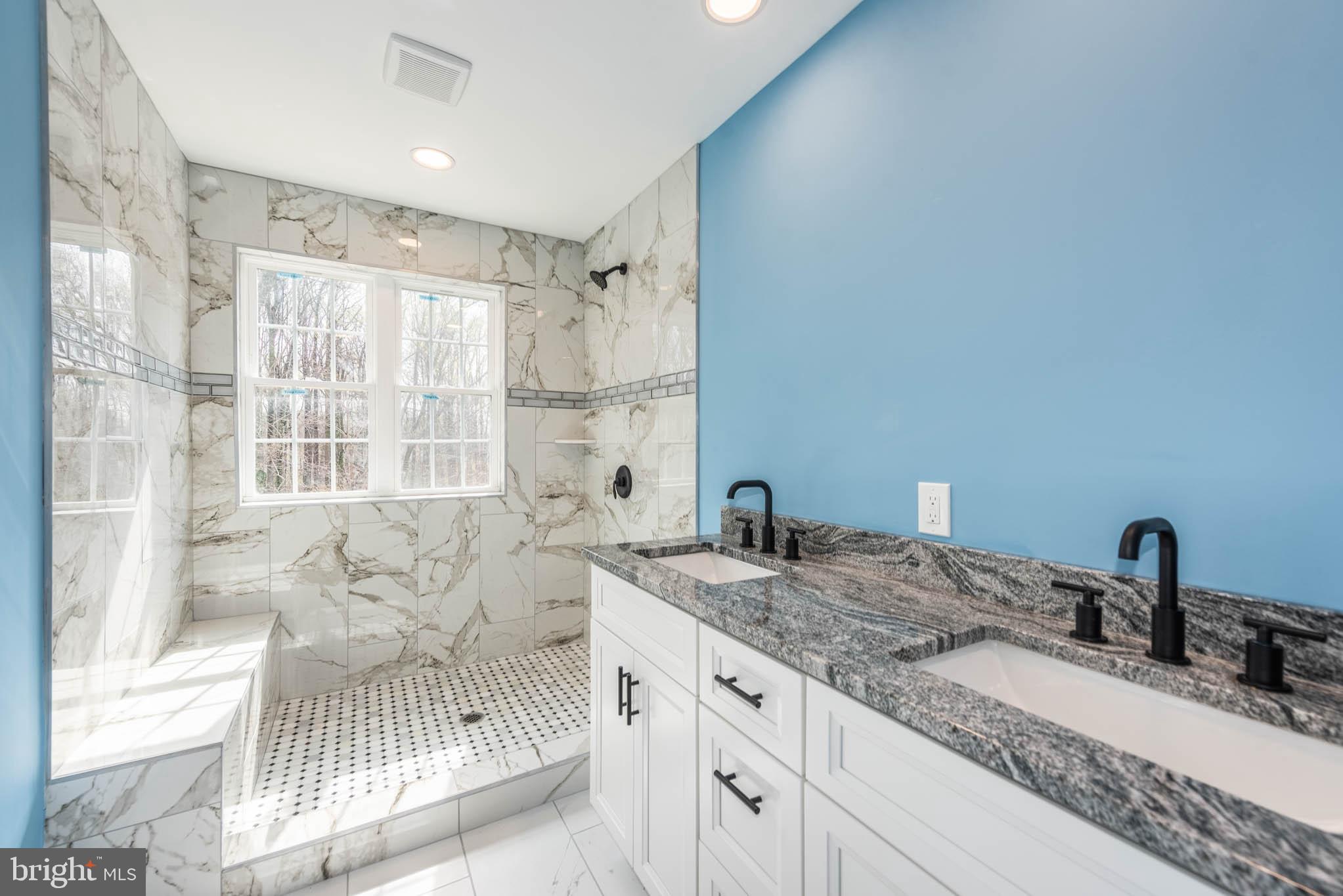 8307 Bletzer Road Baltimore, MD 21222 - Photo 18 of 37 a bathroom with double vanity sinks and a bathtub
