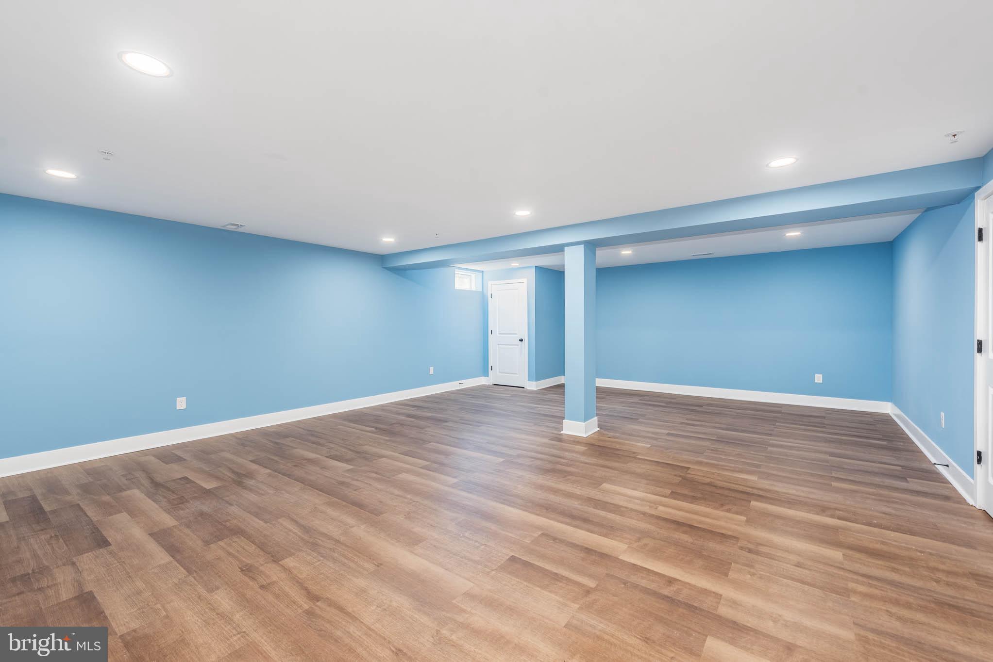 8307 Bletzer Road Baltimore, MD 21222 - Photo 30 of 37 a view of empty room with wooden floor