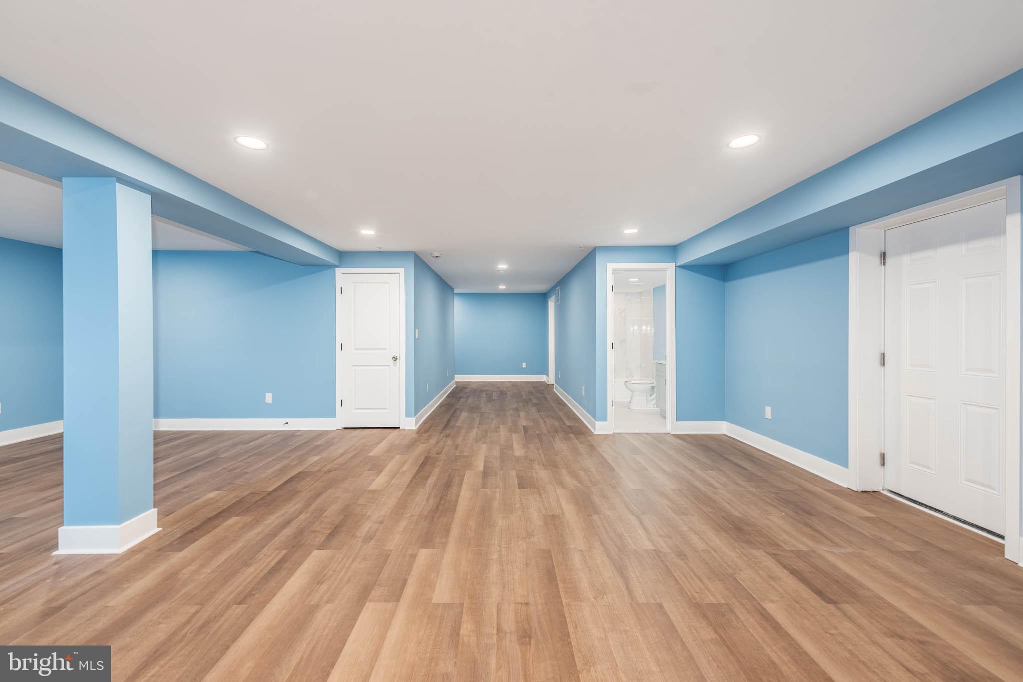 8307 Bletzer Road Baltimore, MD 21222 - Photo 32 of 37 a view of empty room with wooden floor