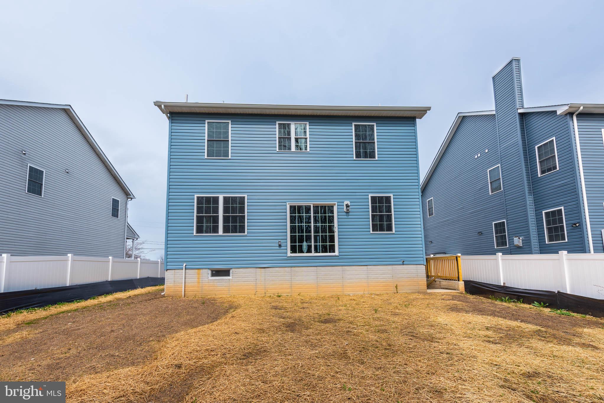 8307 Bletzer Road Baltimore, MD 21222 - Photo 34 of 37 a house that has a tree in front of it