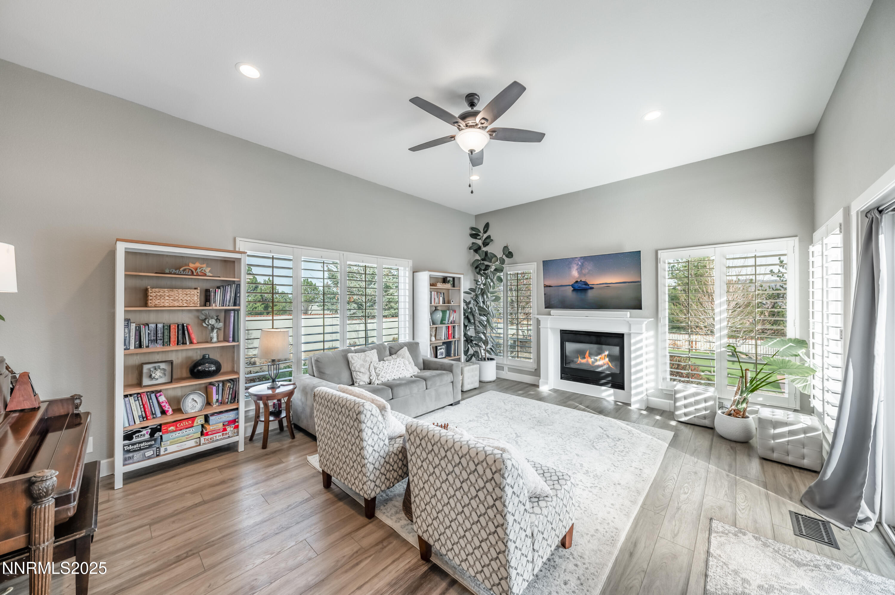 30 Calla Lily Court Reno, NV 89511 - Photo 11 of 34 a living room with furniture fireplace and a large window