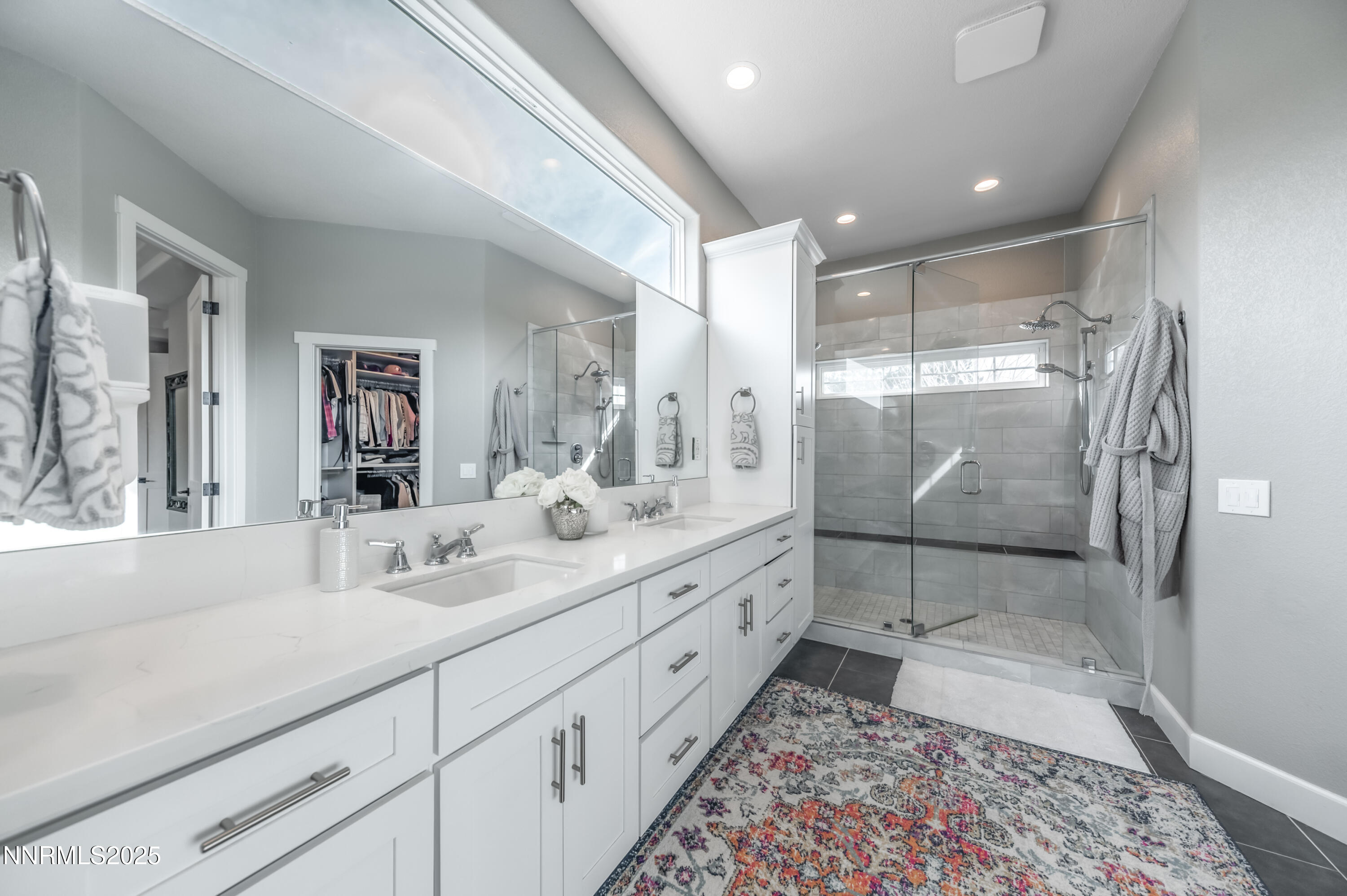 30 Calla Lily Court Reno, NV 89511 - Photo 17 of 34 a bathroom with a double vanity sink mirror and shower