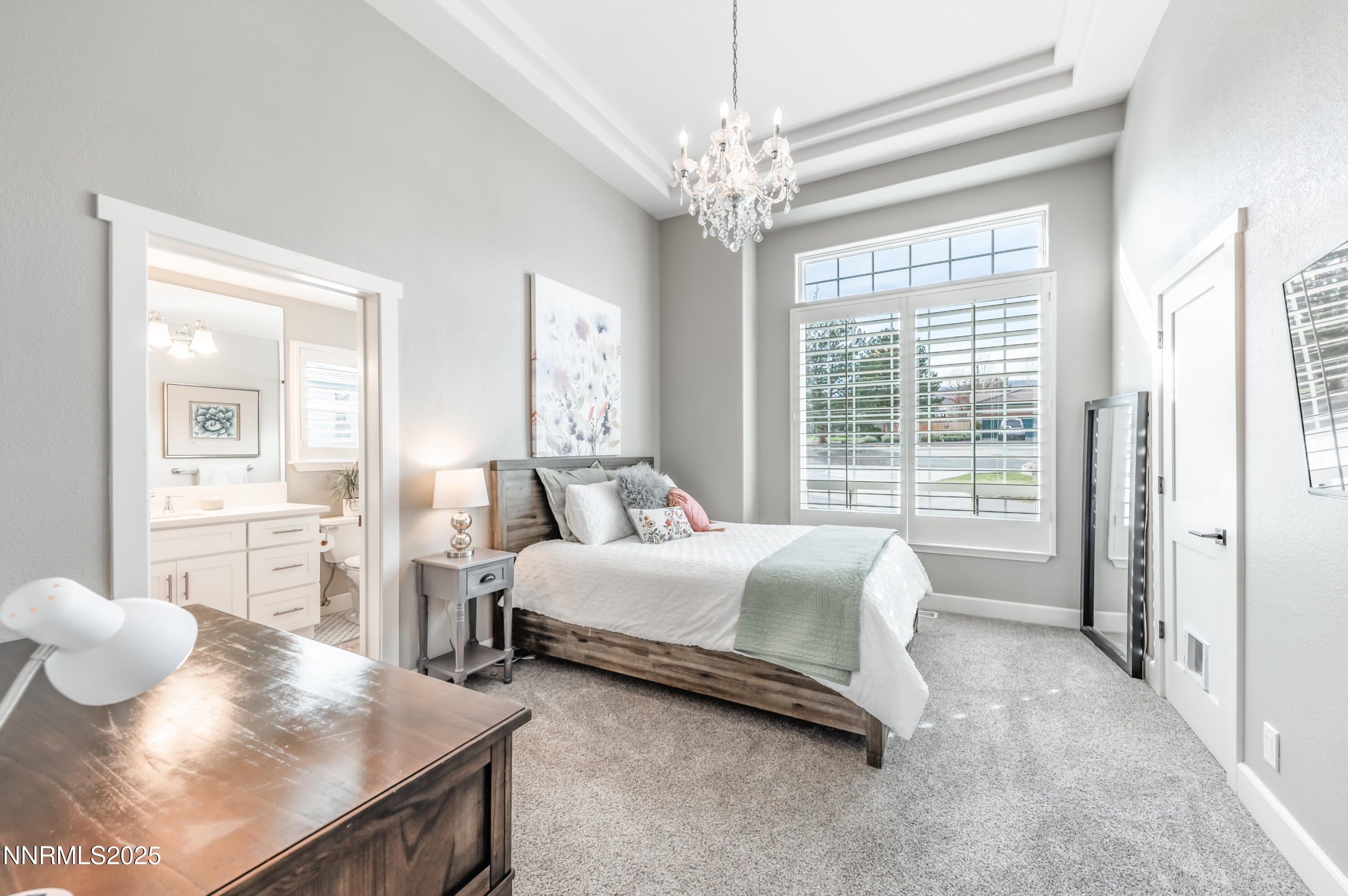 30 Calla Lily Court Reno, NV 89511 - Photo 19 of 34 a spacious bedroom with a bed and wooden floor