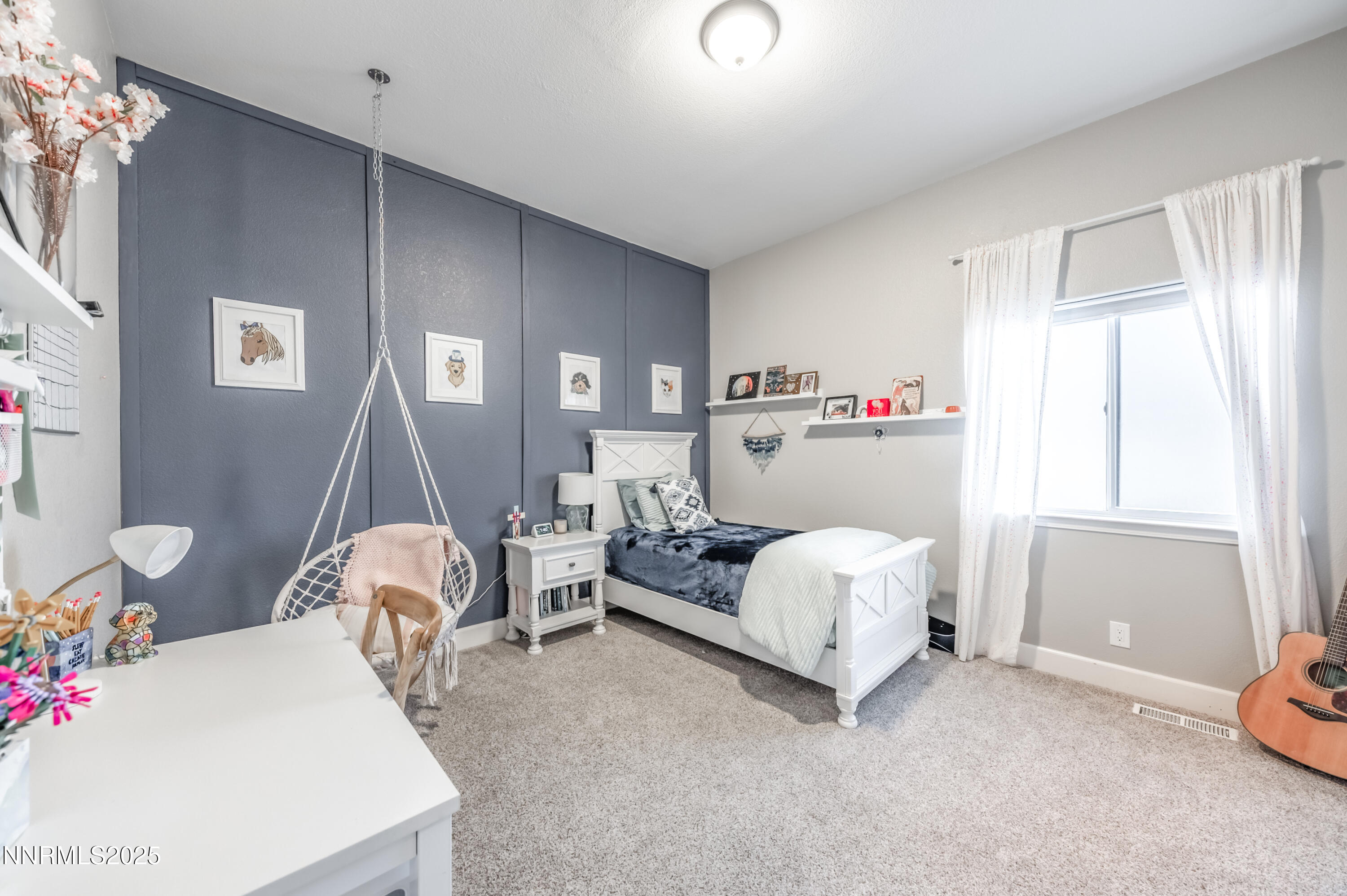 30 Calla Lily Court Reno, NV 89511 - Photo 21 of 34 a bed room with a bed and a chair