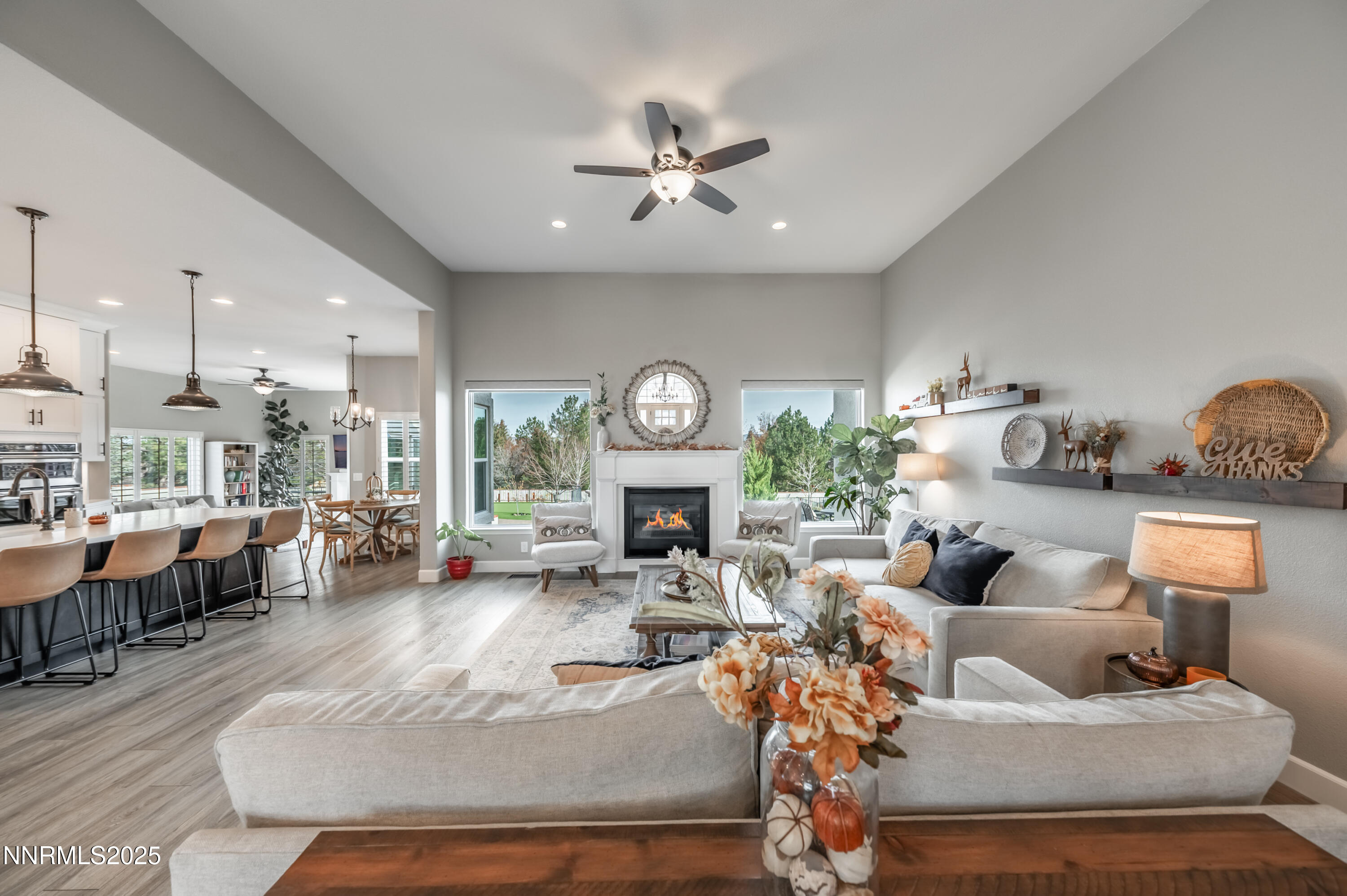 30 Calla Lily Court Reno, NV 89511 - Photo 3 of 34 a living room with fireplace furniture and a chandelier