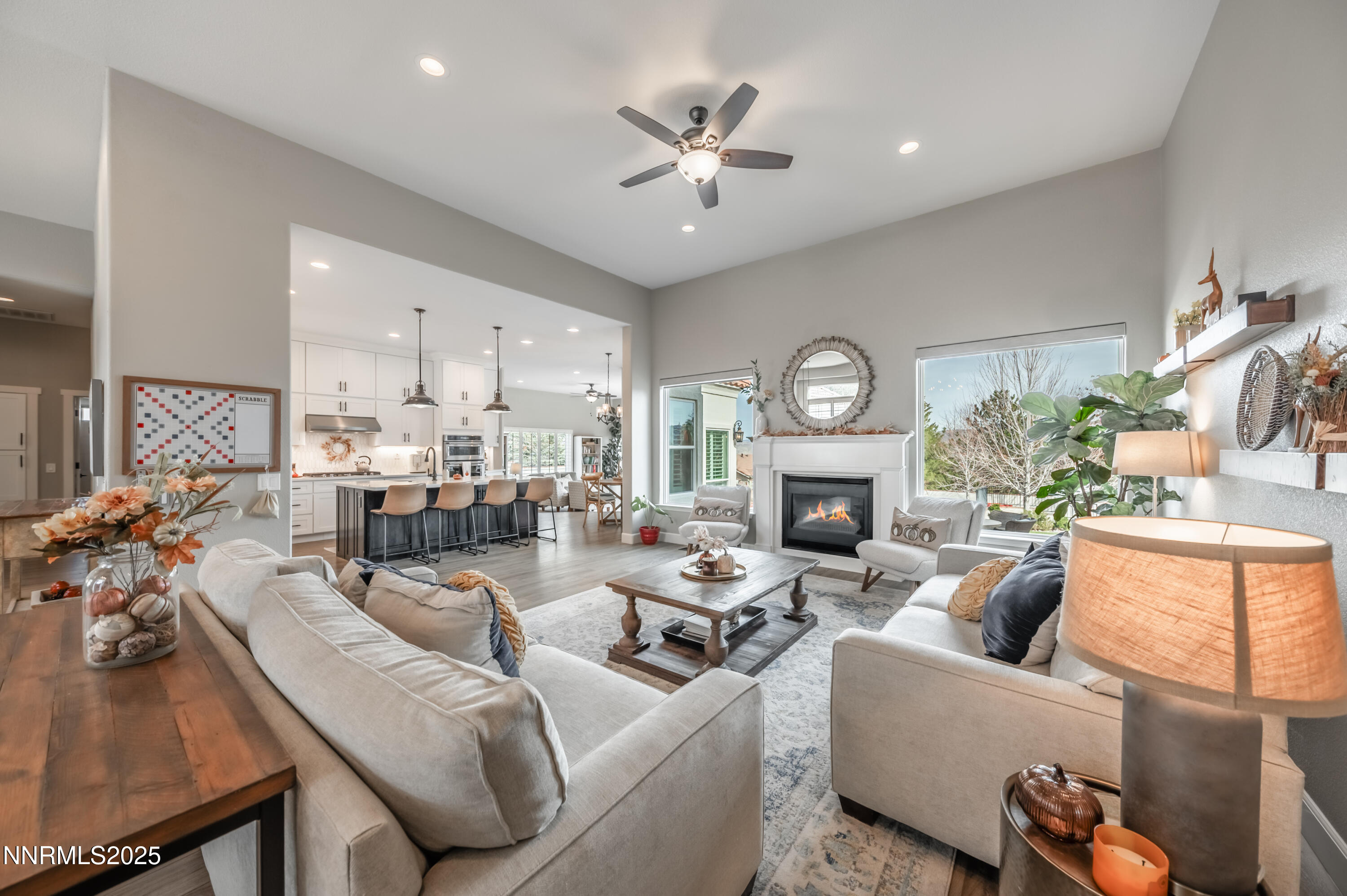 30 Calla Lily Court Reno, NV 89511 - Photo 5 of 34 a living room with furniture a fireplace and a chandelier