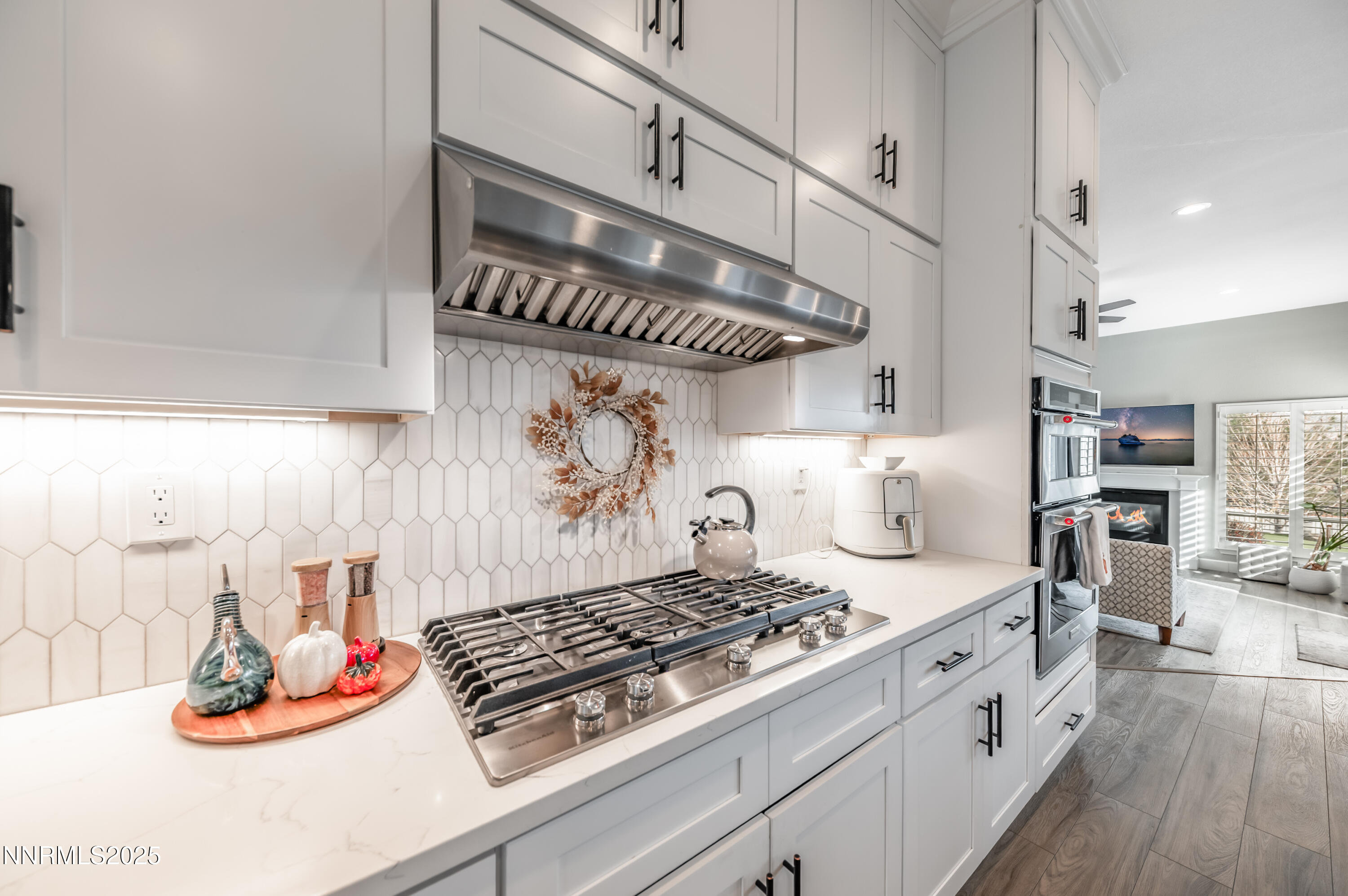 30 Calla Lily Court Reno, NV 89511 - Photo 8 of 34 a kitchen with a stove and wooden floor