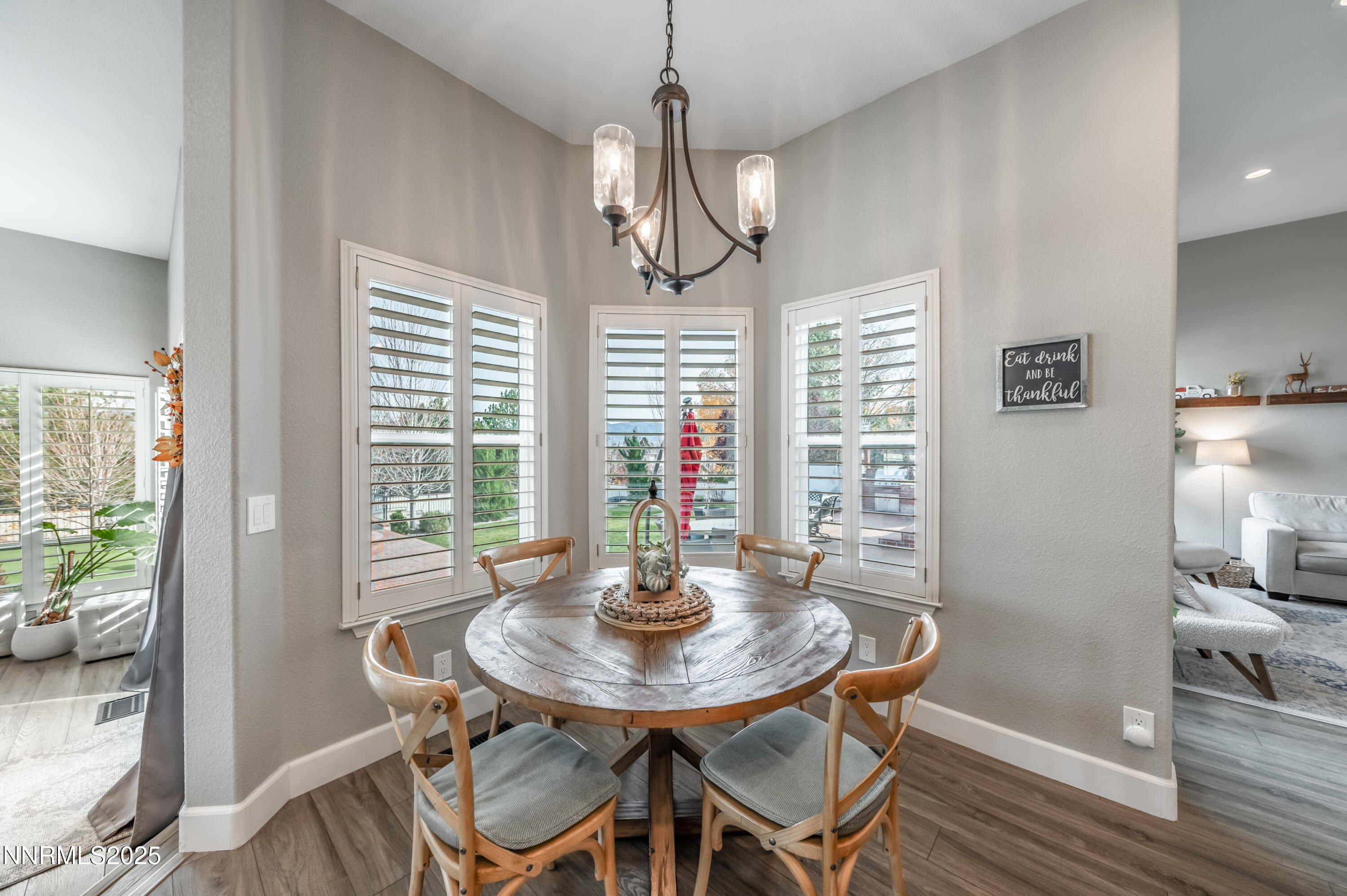 30 Calla Lily Court Reno, NV 89511 - Photo 10 of 34 a view of a dining room with furniture window and wooden floor