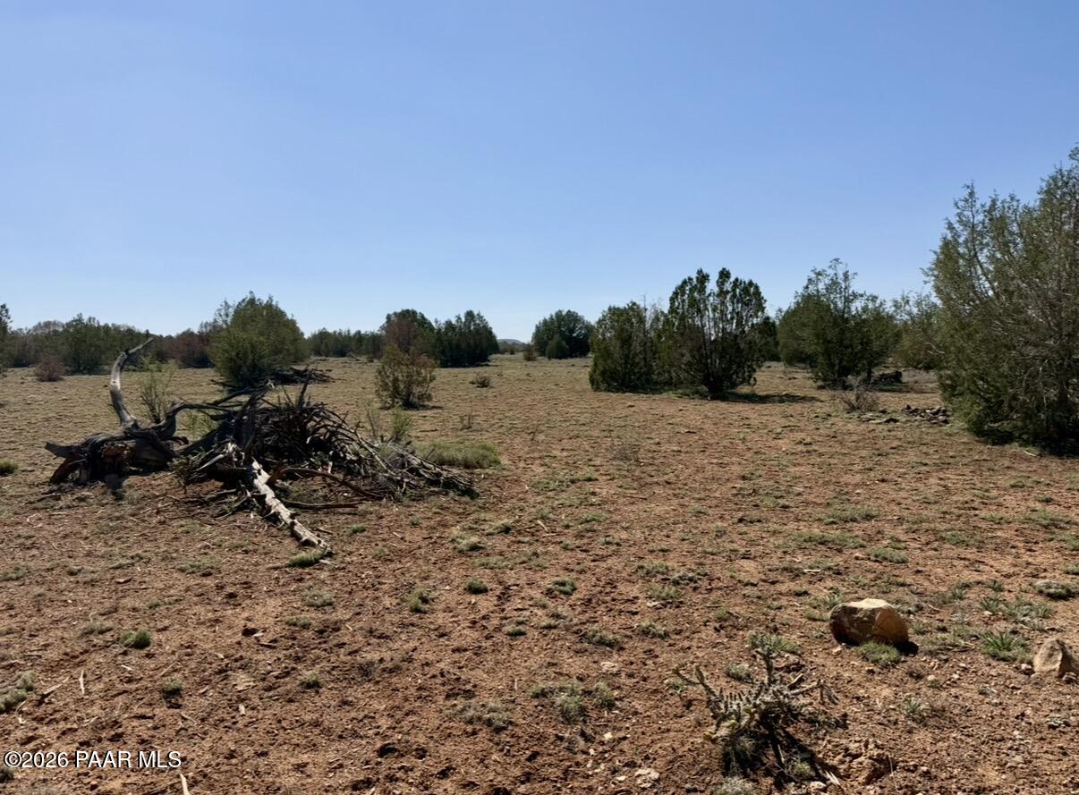 W26 Prairie Dog Road Ash Fork, AZ 86320 - Photo 8 of 10 a view of a field with wooden fence