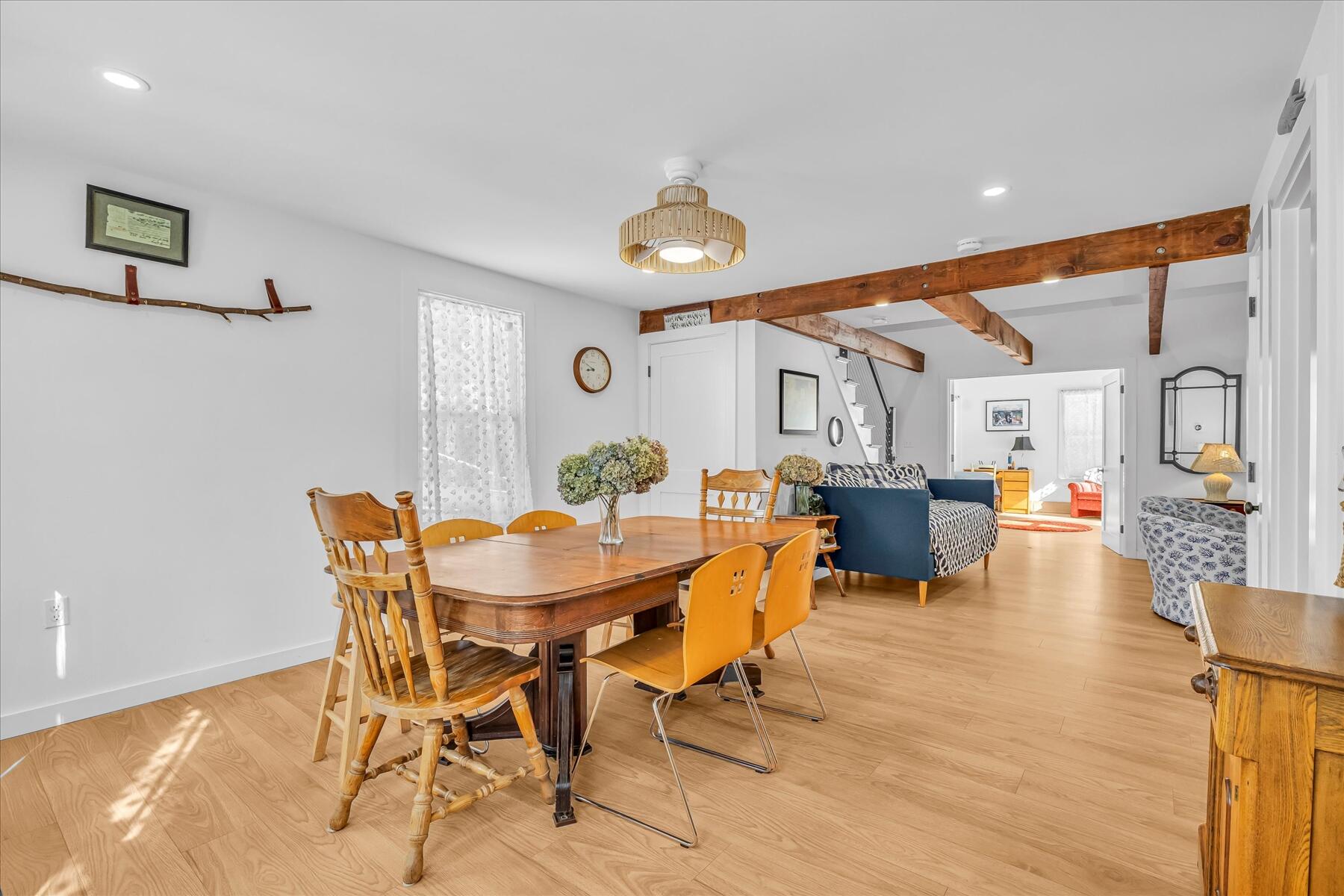 82 Old Fields Road Sandwich, MA 02563 - Photo 13 of 34 a view of a dining room with furniture and wooden floor