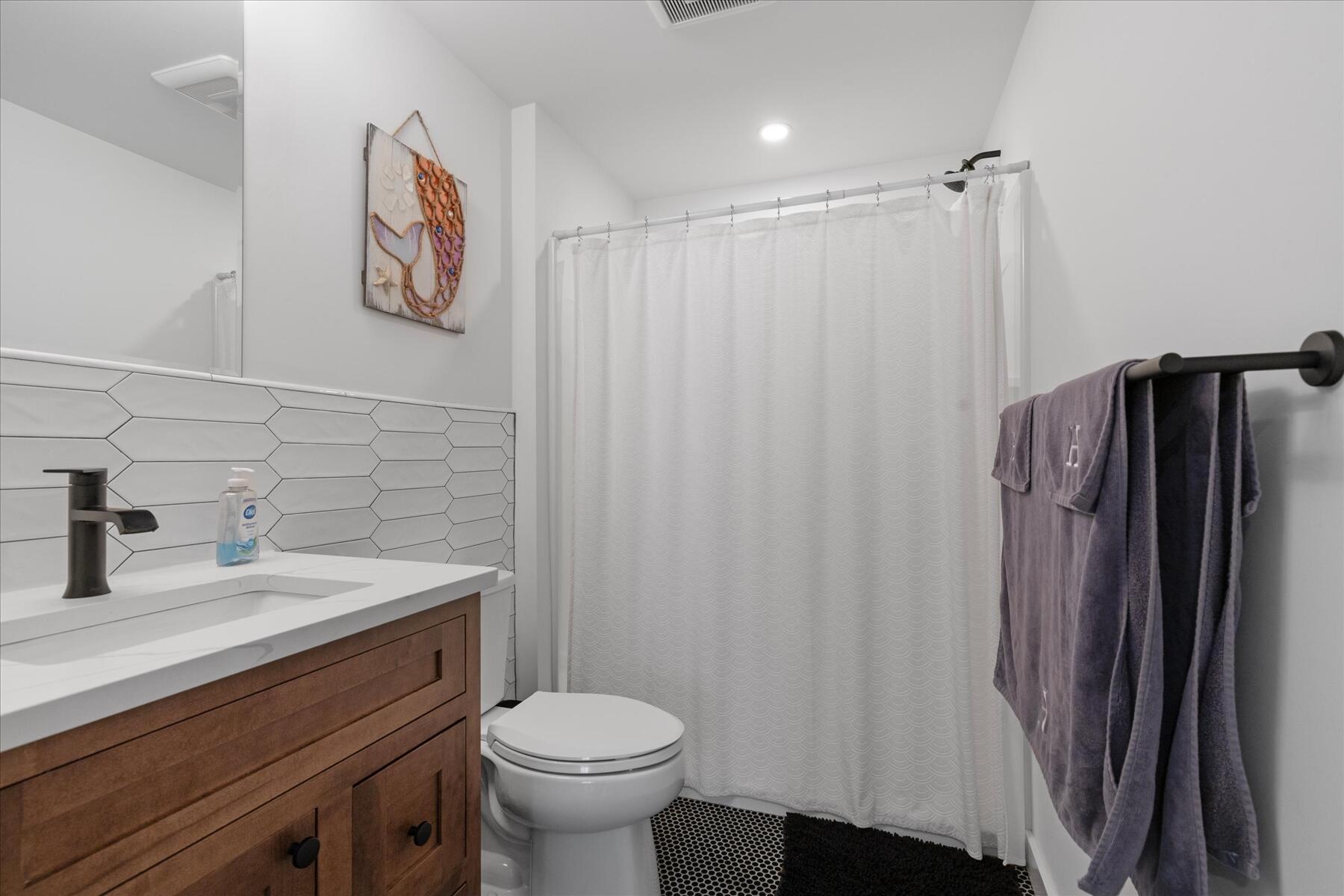 82 Old Fields Road Sandwich, MA 02563 - Photo 14 of 34 a bathroom with a sink toilet and vanity