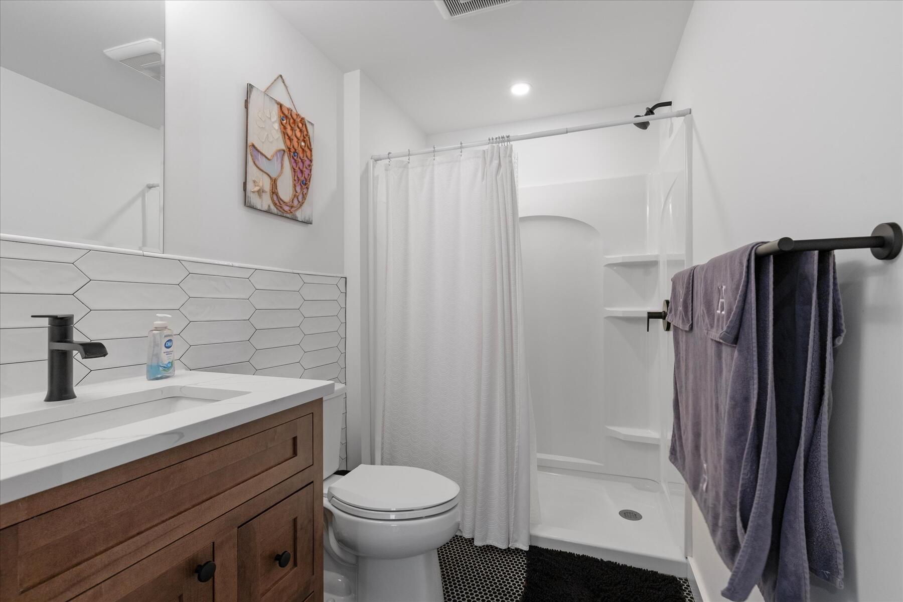 82 Old Fields Road Sandwich, MA 02563 - Photo 15 of 34 a bathroom with a sink a toilet and shower